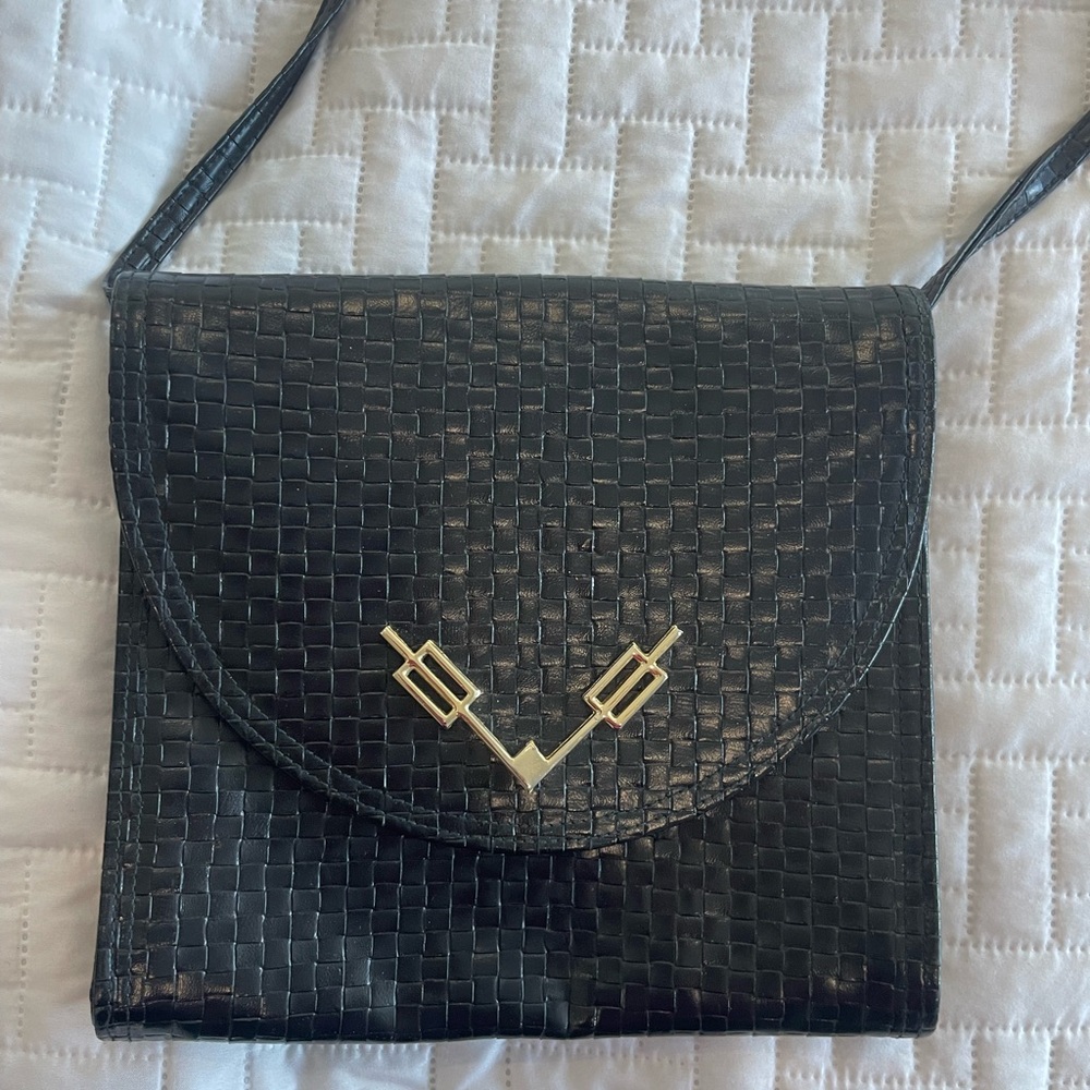 Shirl Miller woven leather clutch with strap